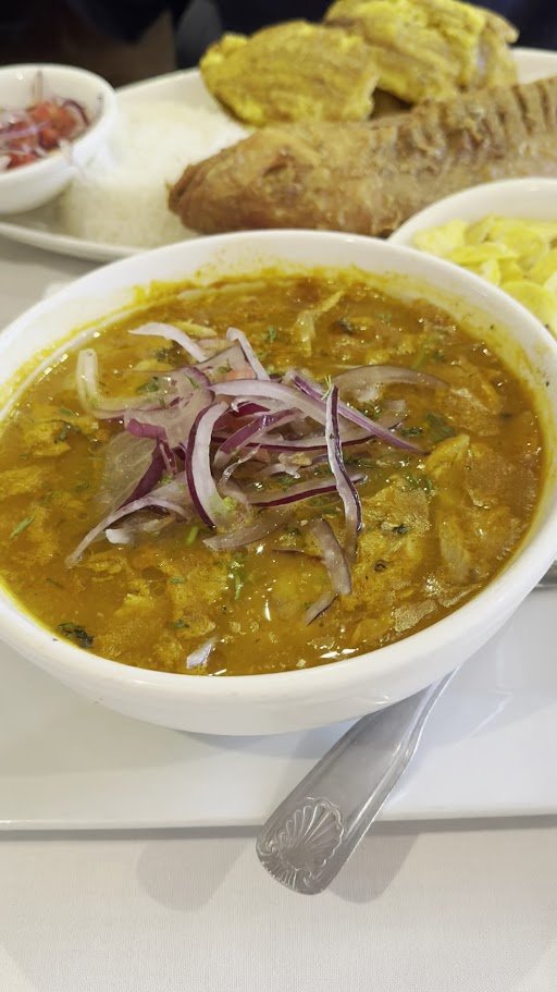 Colorful restaurant dishes with rice and seafood.