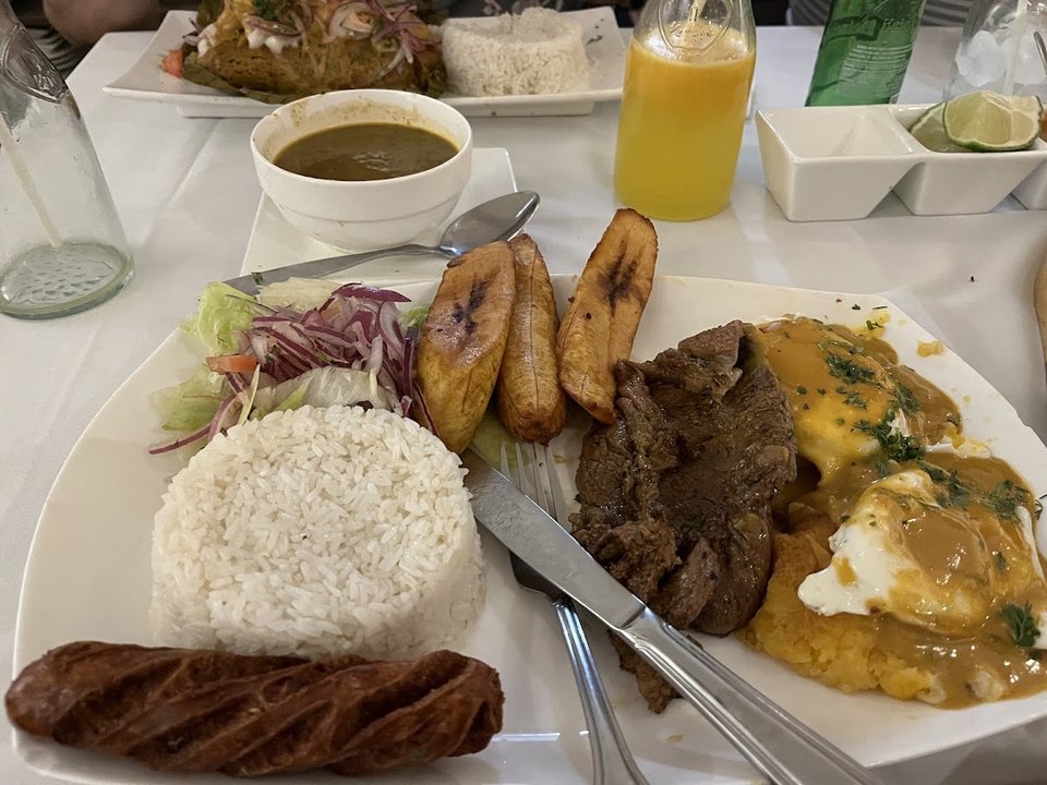 Plates of Ecuadorian food on a table.
