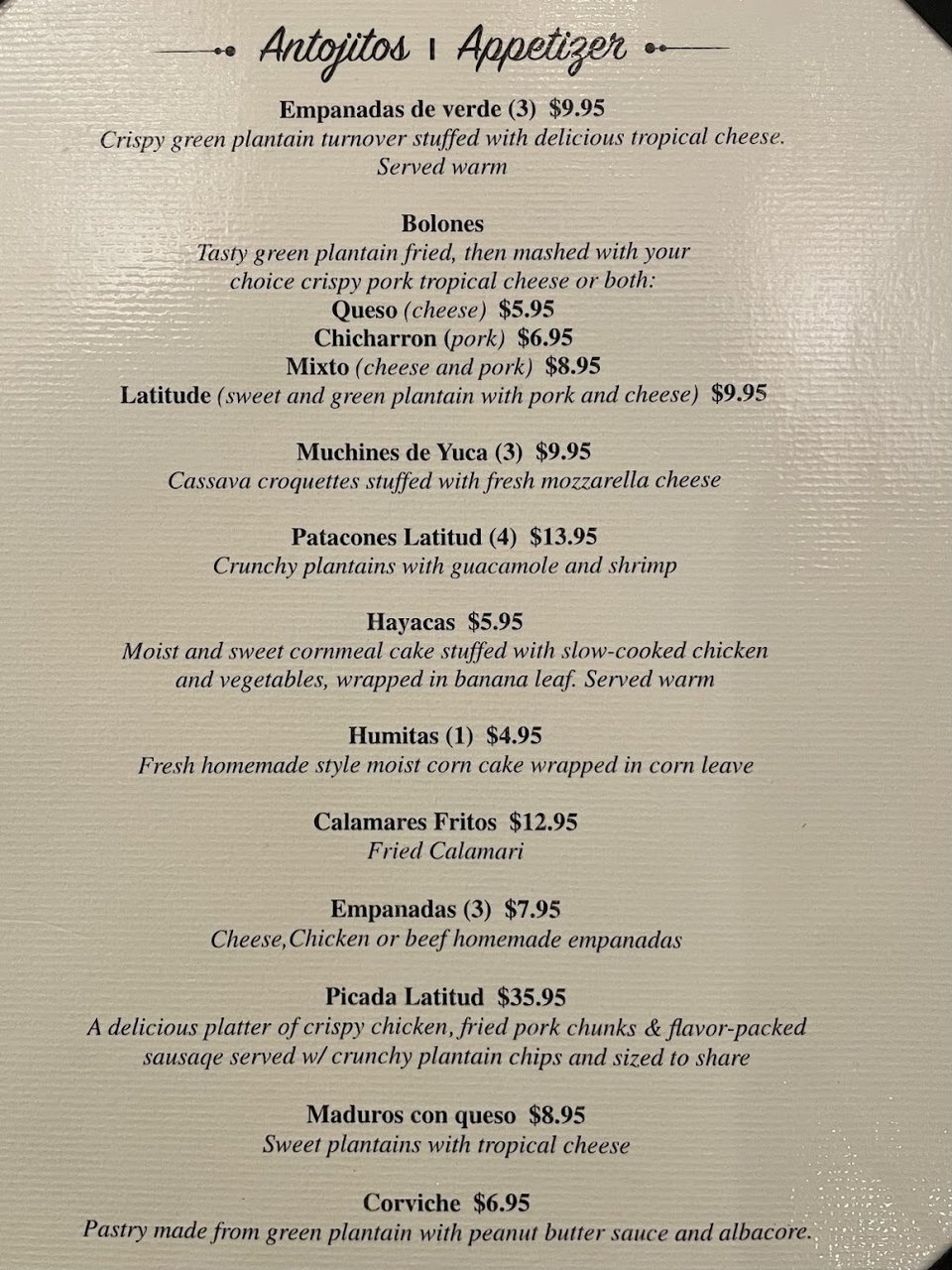 Printed menu with cocktails and seafood dishes.